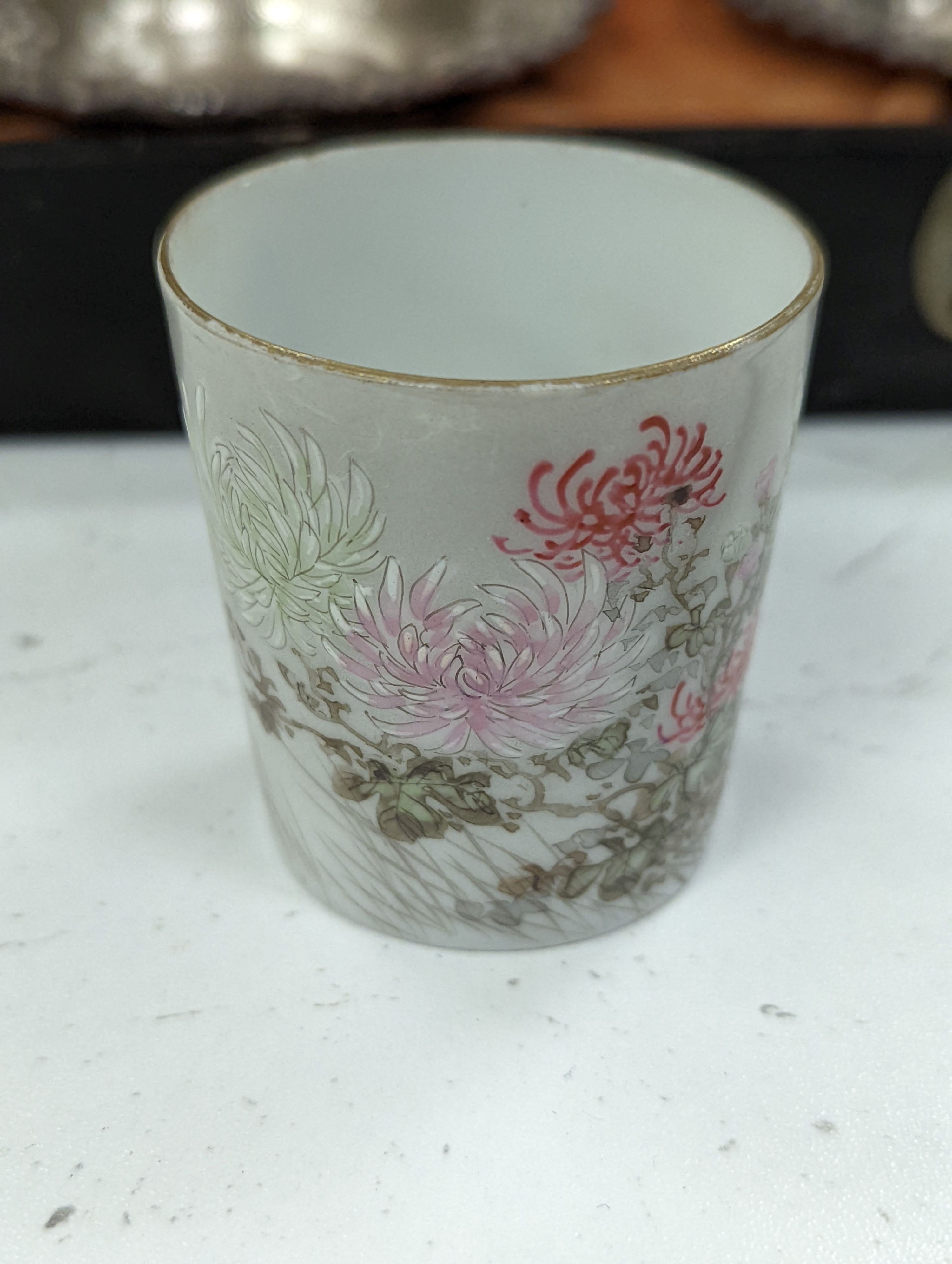 A cased Japanese white metal and eggshell porcelain six piece coffee set, maker’s mark only, case 39.5 cm wide